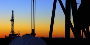 Oil price retreats, energy stocks edge lower
