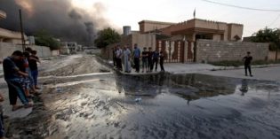 Oil fires cast black cloud over Iraqi town retaken from Islamic State