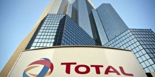 Total says to cut costs by a further $1 billion