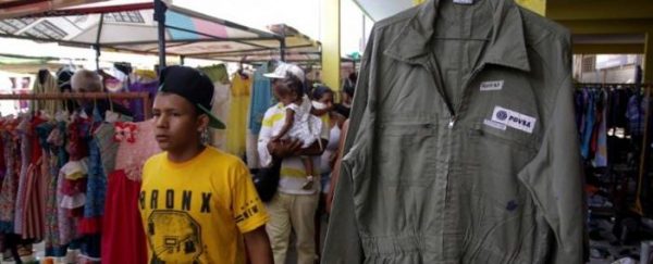 Selling uniforms for food, Venezuela oil workers feel the pinch